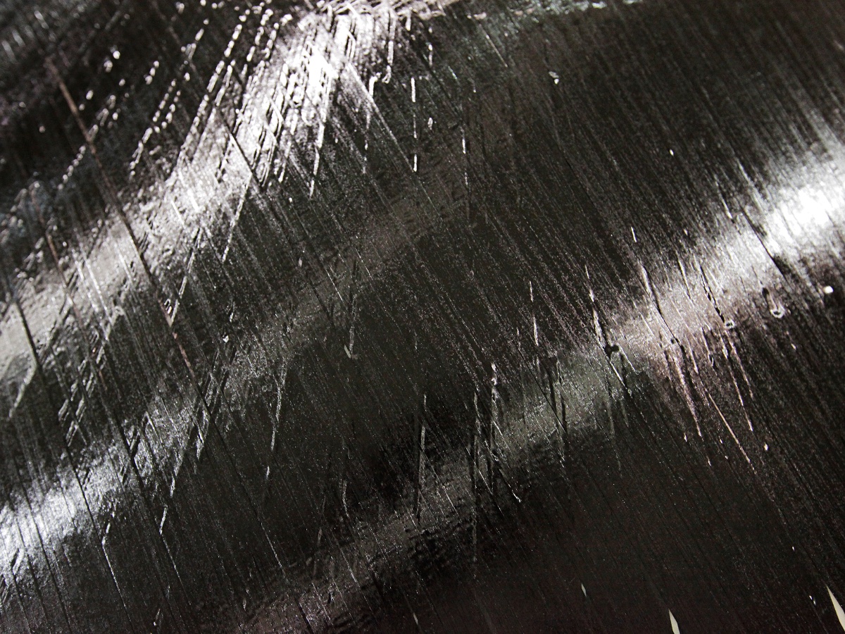 This closeup shows a sheet of carbon-fiber-and-epoxy ribbons created by ISAAC.